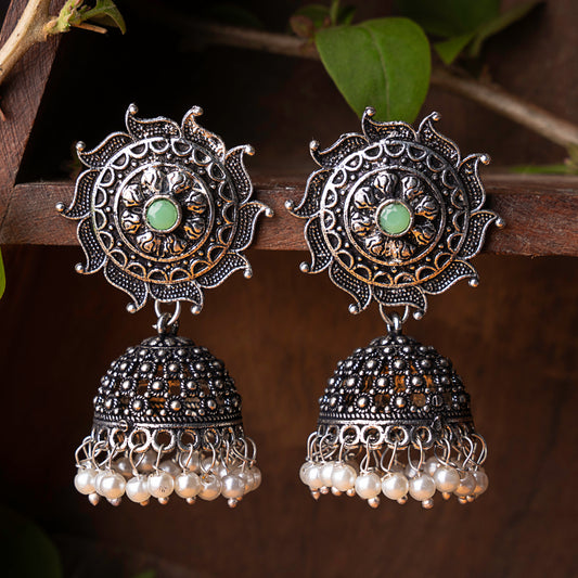 Pista Stone Studded German Silver Statement Earrings With Brass Jhumki