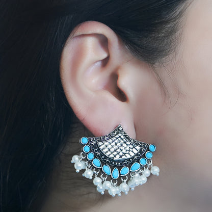 Sky Blue Stone Studded Lotus Petal Shaped Oxidised Earrings With Hanging Line Of Pearl