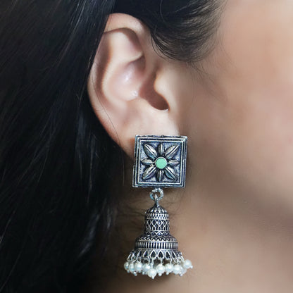 Pista Stone Studded Oxidised Earrings With Hanging Pearls