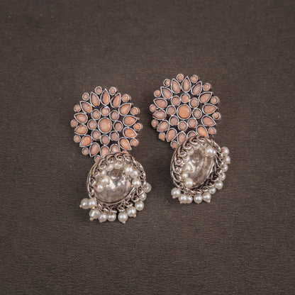 Light Orangish Stone Studded German Silver Statement Earrings With Brass Jhumki