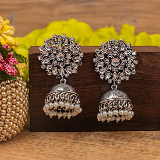 White Stone Studded German Silver Statement Earrings With Brass Jhumki