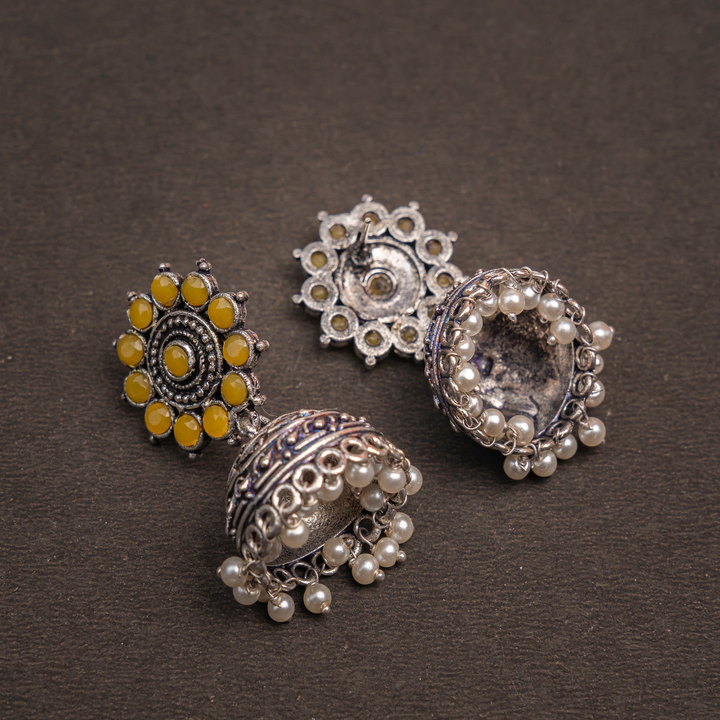 Yellow Stone Studded German Silver Jhumki Earrings With Hanging Pearls