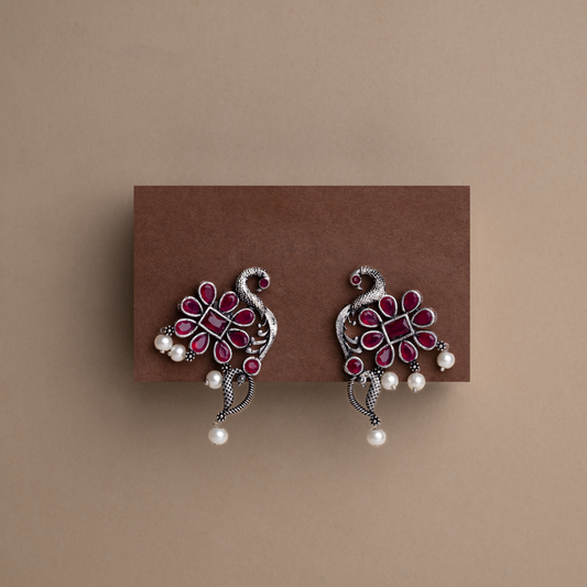 Red Stone Studded Peacock Motif Stud Earrings With Hanging Pearls