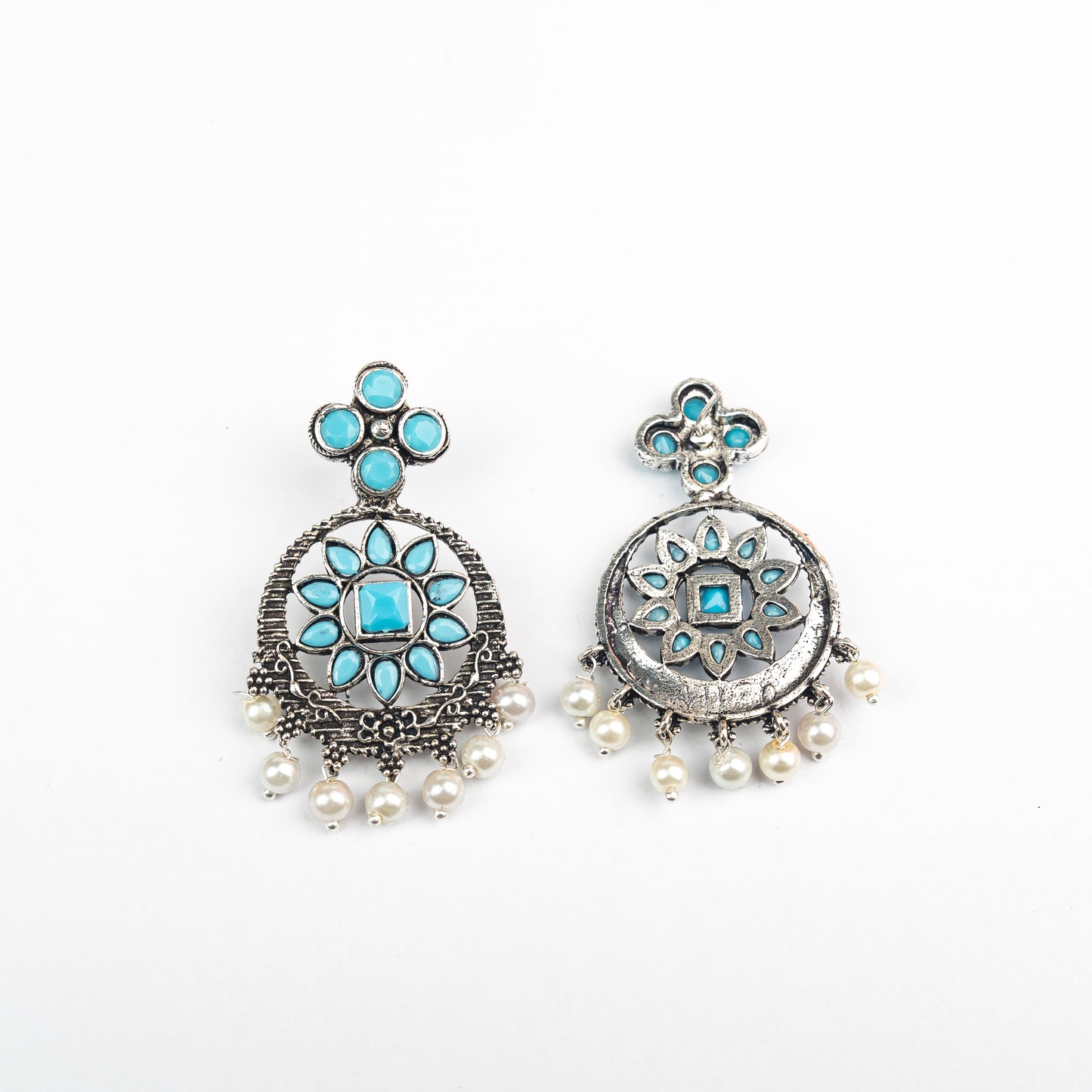 Sky Blue Stone Studded German Silver Stud Earrings With Hanging Pearls