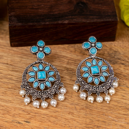 Sky Blue Stone Studded German Silver Stud Earrings With Hanging Pearls