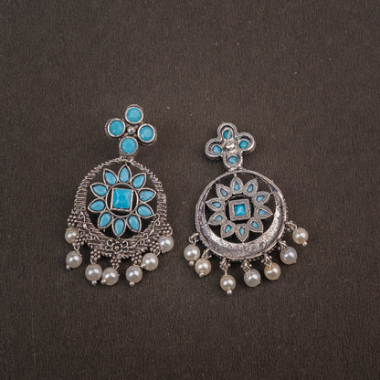 Sky Blue Stone Studded German Silver Stud Earrings With Hanging Pearls