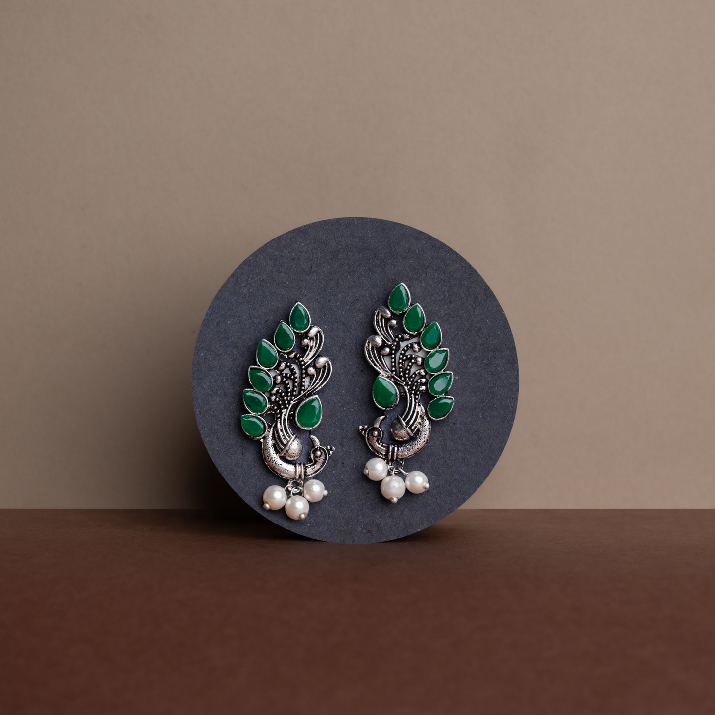 Green Stone Studded Peacock Motif Stud Earrings With Hanging Pearls