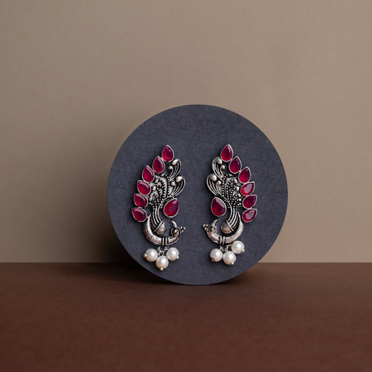 Red Stone Studded Peacock Motif Stud Earrings With Hanging Pearls