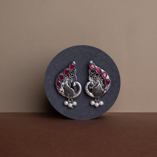 Red Stone Studded Peacock Motif Stud Earrings With Hanging Pearls