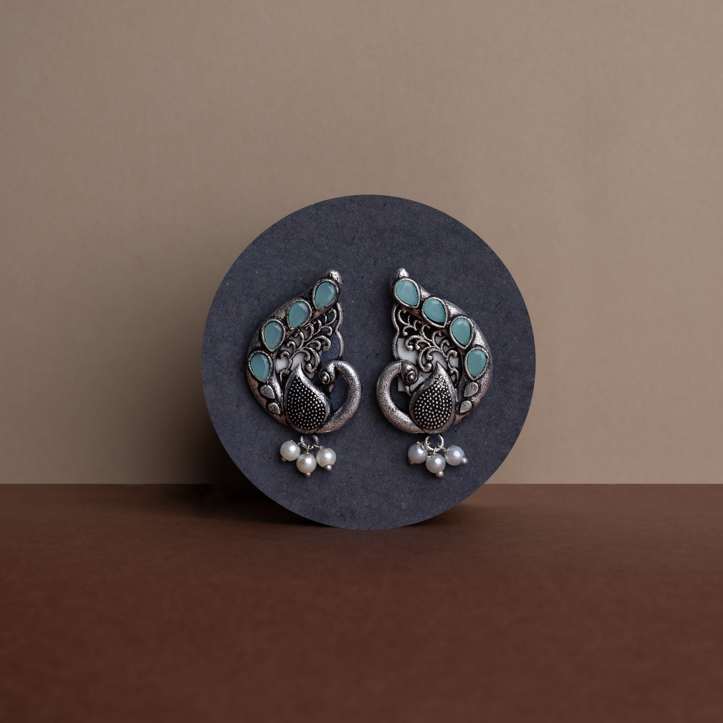 Mint Stone Studded Peacock Motif Stud Earrings With Hanging Pearls