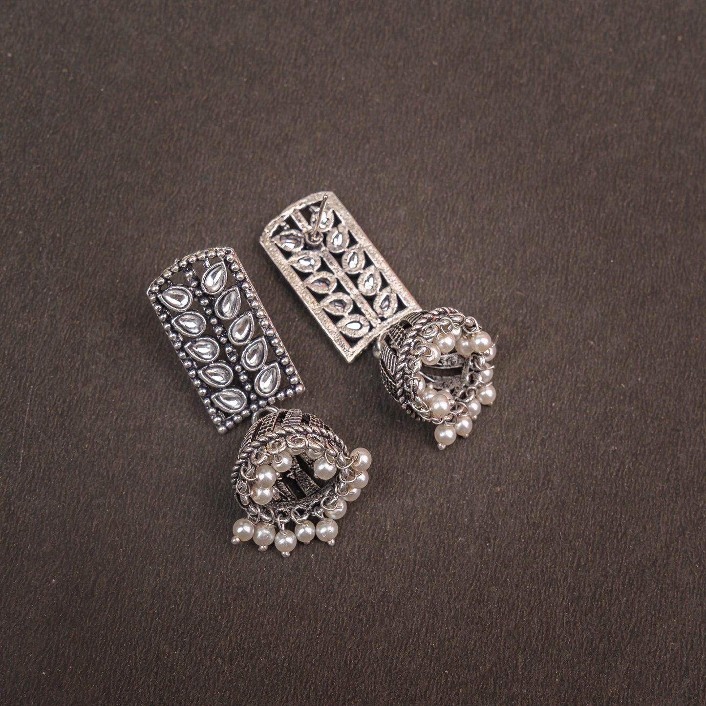 White Stone Studded German Silver Statement Earrings With Brass Jhumki