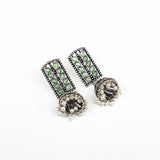 Pista Stone Studded German Silver Statement Earrings With Brass Jhumki