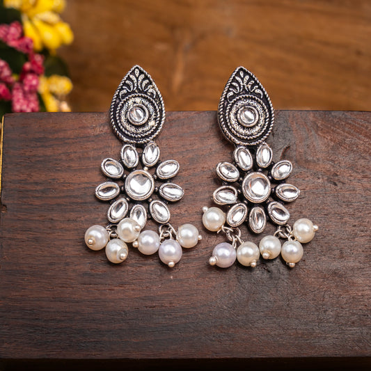 White Stone Studded Oxidised Earrings With Hanging Pearls