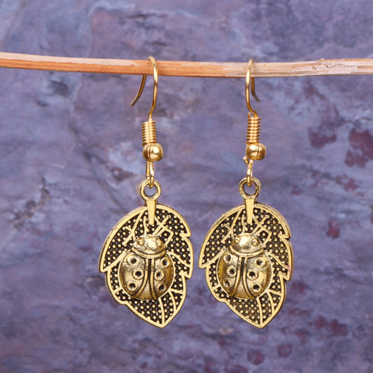 Leaf Beetle Shaped Golden Polished Oxidised Danglers