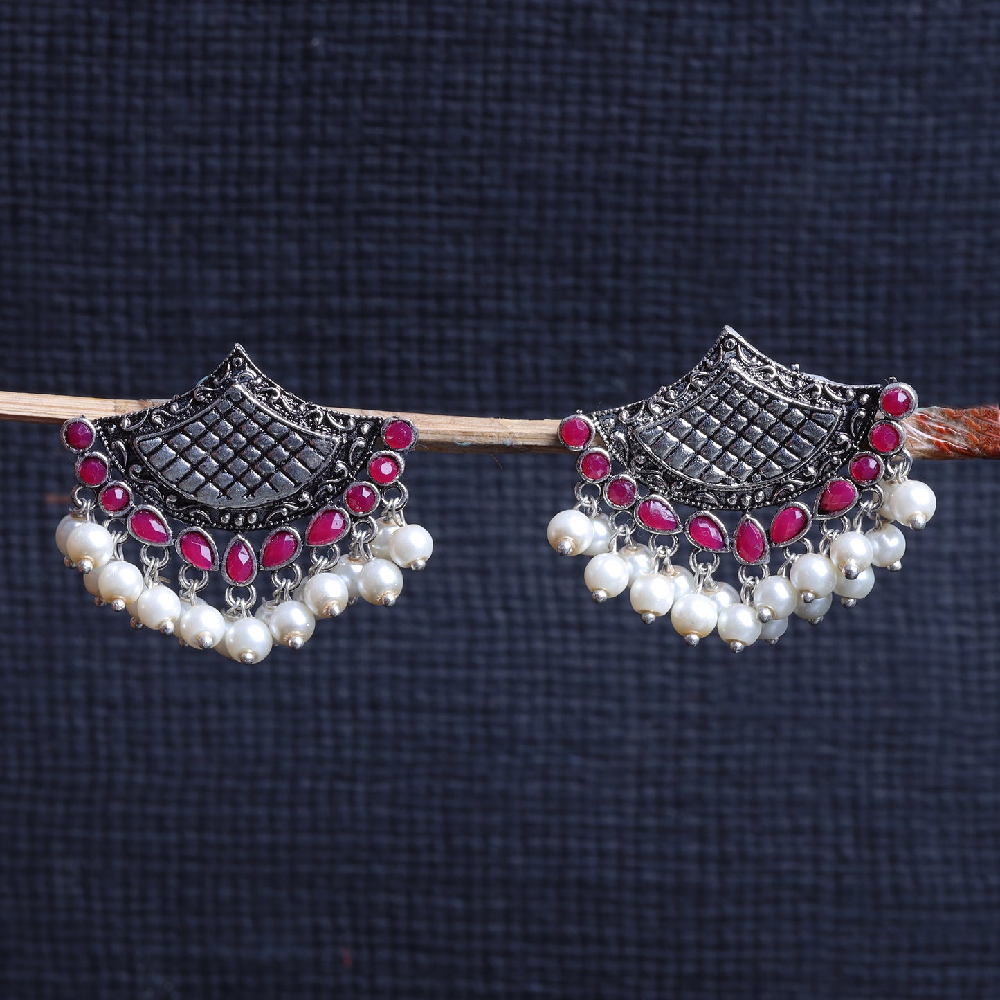 Red Stone Studded Lotus Petal Shaped Oxidised Earrings With Hanging Line Of Pearl