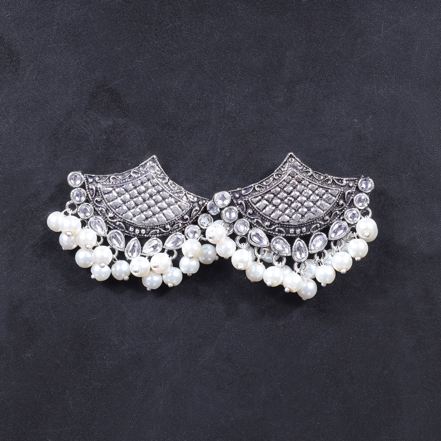 White Stone Studded Lotus Petal Shaped Oxidised Earrings With Hanging Line Of Pearl