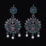 Green Stone Studded Laxmi Motif Oxidised Earrings With Hanging Pearls