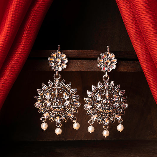 White Stone Studded Laxmi Motif Oxidised Earrings With Hanging Pearls