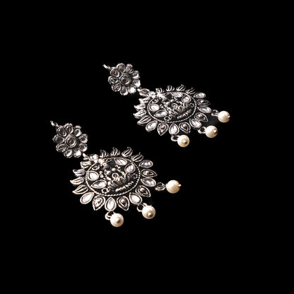 White Stone Studded Laxmi Motif Oxidised Earrings With Hanging Pearls