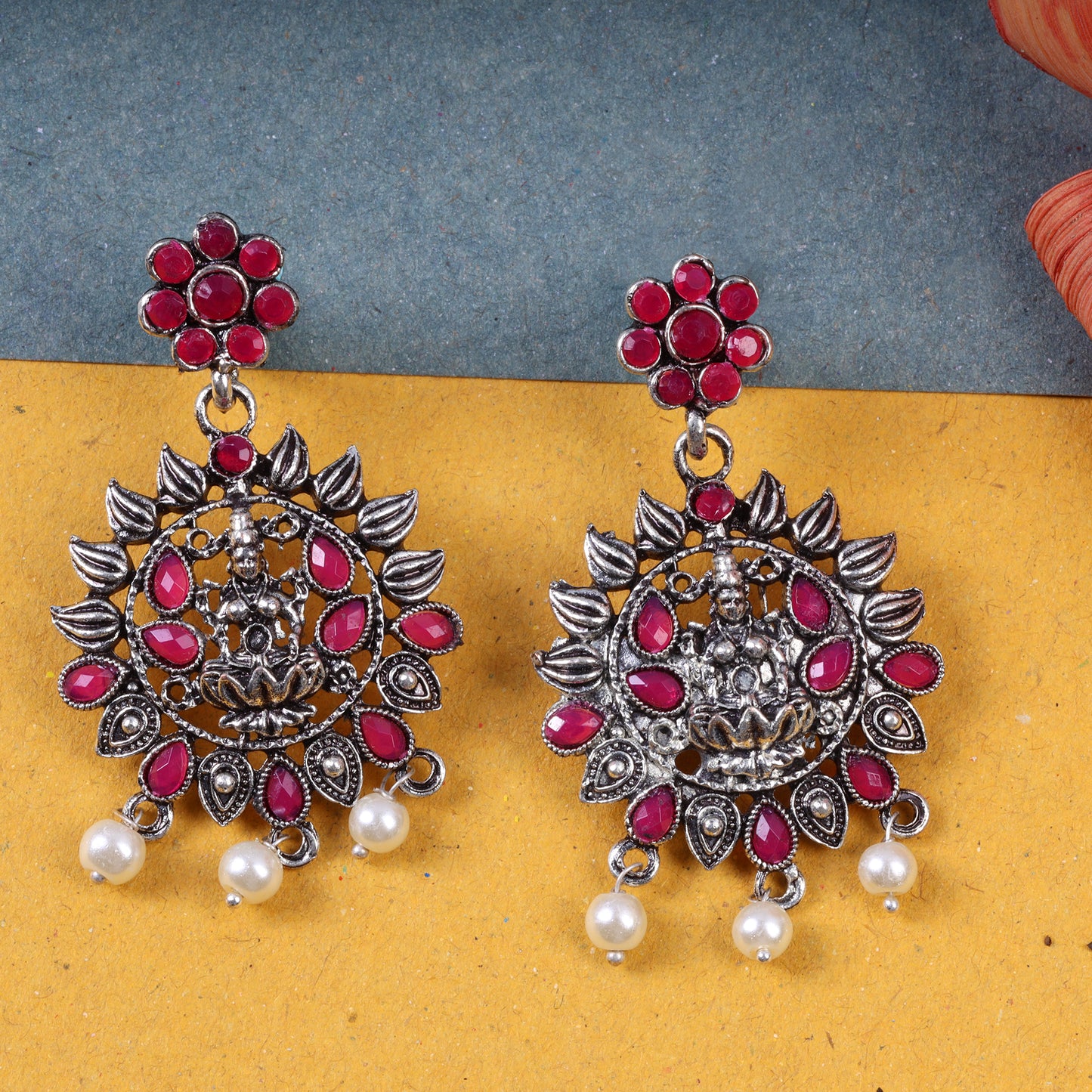 Red Stone Studded Laxmi Motif Oxidised Earrings With Hanging Pearls