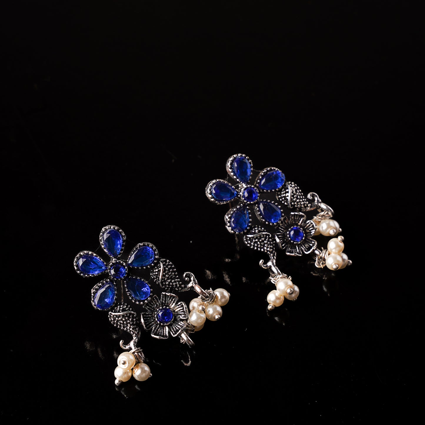 Blue Stone Studded Oxidised Earrings With Hanging Pearl