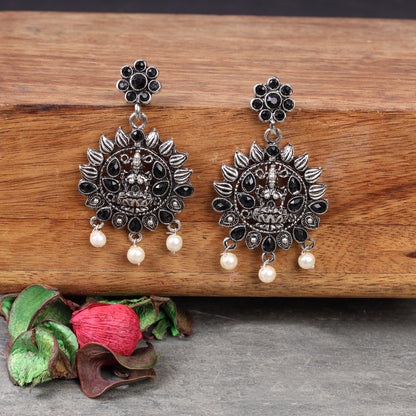 Black Stone Studded Laxmi Motif Oxidised Earrings With Hanging Pearls