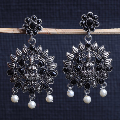 Black Stone Studded Laxmi Motif Oxidised Earrings With Hanging Pearls