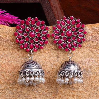 Red Stone Studded German Silver Statement Earrings With Brass Jhumki