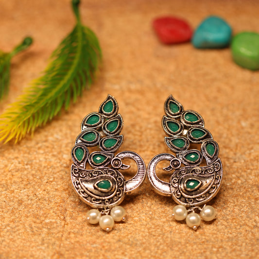 Green Stone Studded Peacock German Silver Earrings With Hanging Pearls