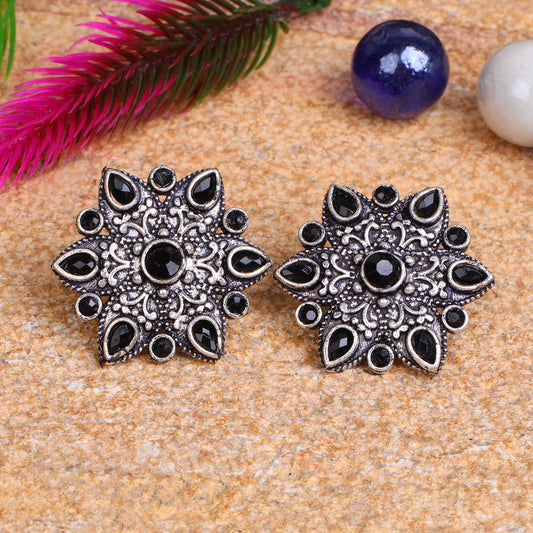 Black Stone Studded Star Shaped German Silver Stud Earrings