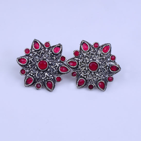 Red Stone Studded Star Shaped German Silver Stud Earrings