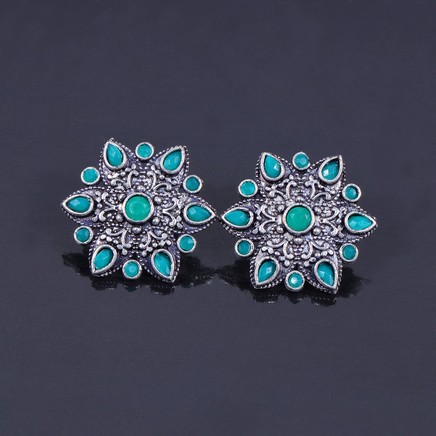 Green Stone Studded Star Shaped German Silver Stud Earrings