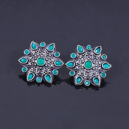 Green Stone Studded Star Shaped German Silver Stud Earrings